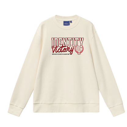 Beige sweatshirt with 'Identity Victory' text and logo on a white background